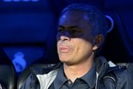 Real Madrid's Jose Mourinho sticks out his tongue at the Santiago Bernabeu stadium in Madrid on May 8, 2013